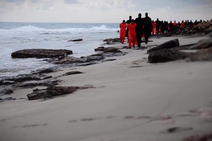 An image from a video released Feb. 15 shows Islamic militants leading Egyptian Christian hostages along a beach before they are allegedly beheaded in the Libyan capital of Tripoli.