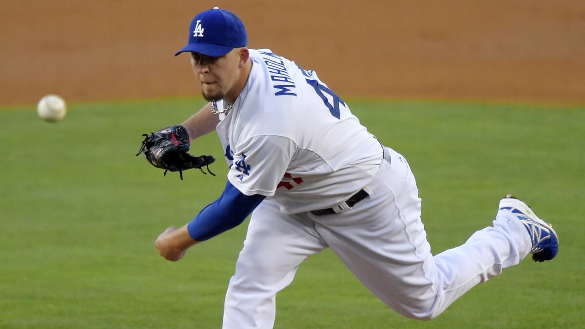 Dodgers starter Paul Maholm delivers a pitch during the team's 1-0 win Saturday over the San Diego Padres at Dodger Stadium.