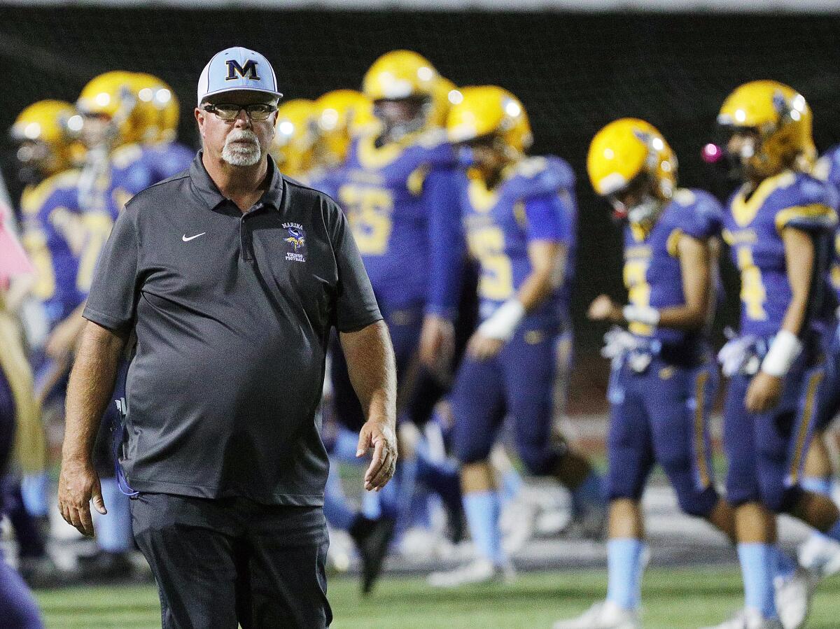 Marina coach Jeff Turley, pictured walking to his sideline before the start of the game against Segerstrom on Oct. 25, has guided the Vikings to their first CIF Southern Section title game.