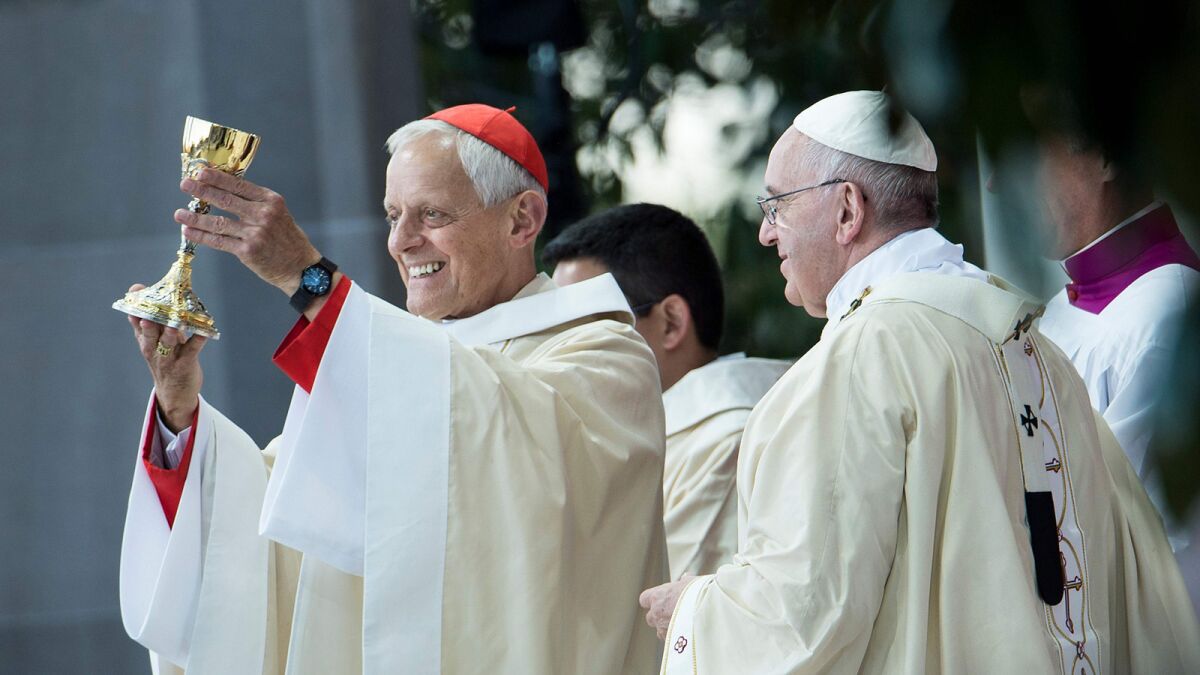 Cardinal Donald Wuerl, left, the archbishop of Washington, D.C., and Pope Francis celebrate a 2015 canonization Mass for the Rev. Junipero Serra in Washington.