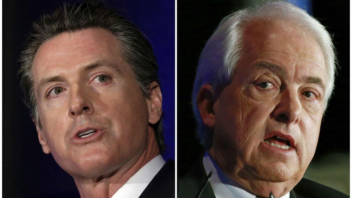 Democratic Lt. Gov. Gavin Newsom, left, and Republican businessman John Cox faced off Monday in a candidate forum in San Francisco.