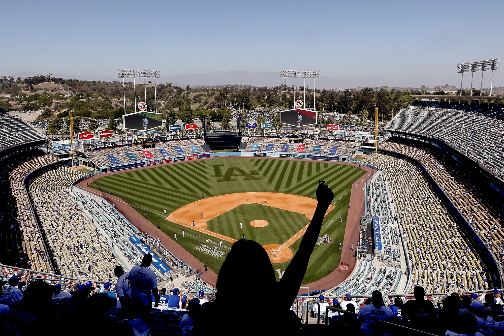 Socially distanced fans attend the Dodgers' home opener.