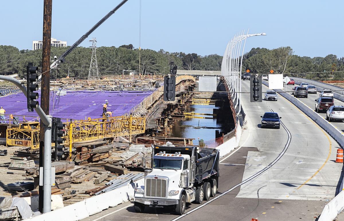 Construction crews work on the new West Mission Bay Bridge on April 13, 2022.