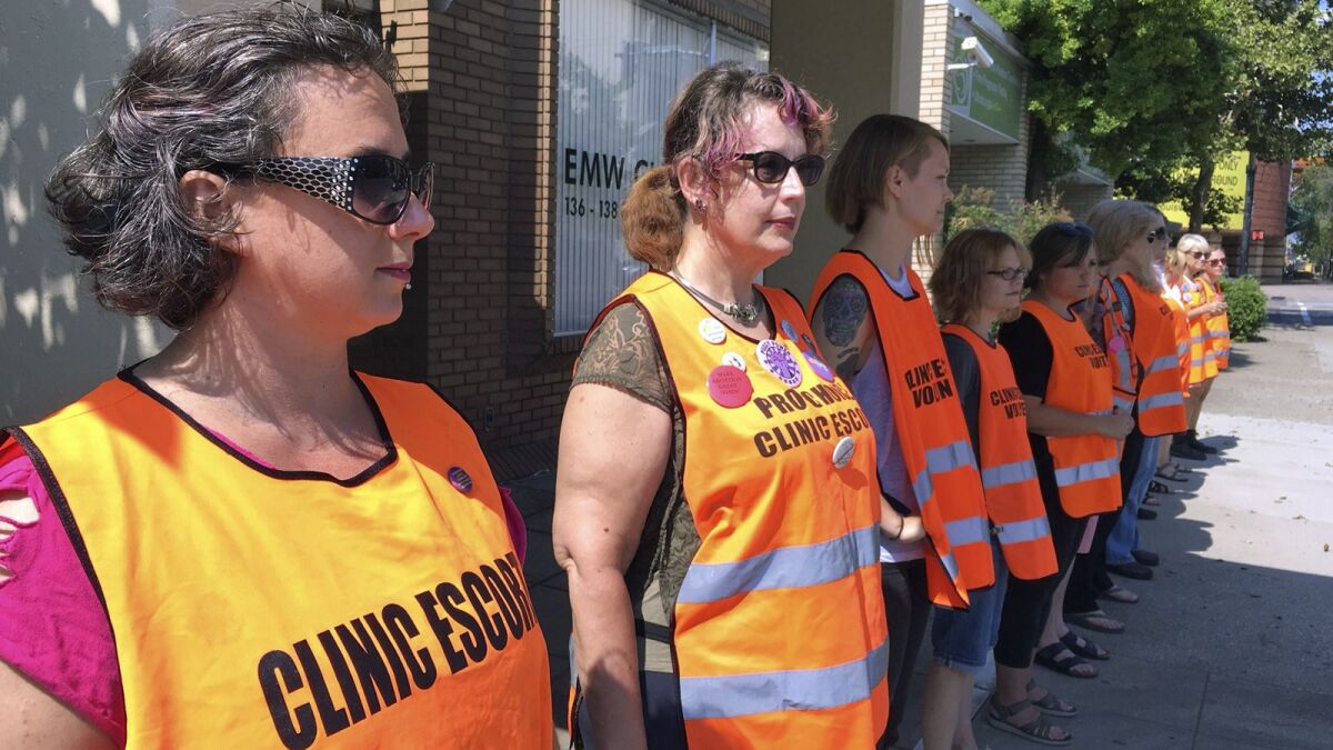 Volunteers line up outside the EMW Women's Surgical Center in Louisville, Ky., in 2017.