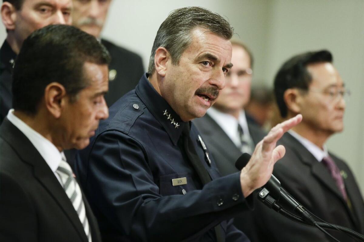 LAPD Chief Charlie Beck, flanked by L.A. Mayor Antonio Villaraigosa and Irvine Mayor Steven Choi, discusses the $1 million reward for information leading to ex-cop Christopher Dorner's arrest at a news conference on Sunday.
