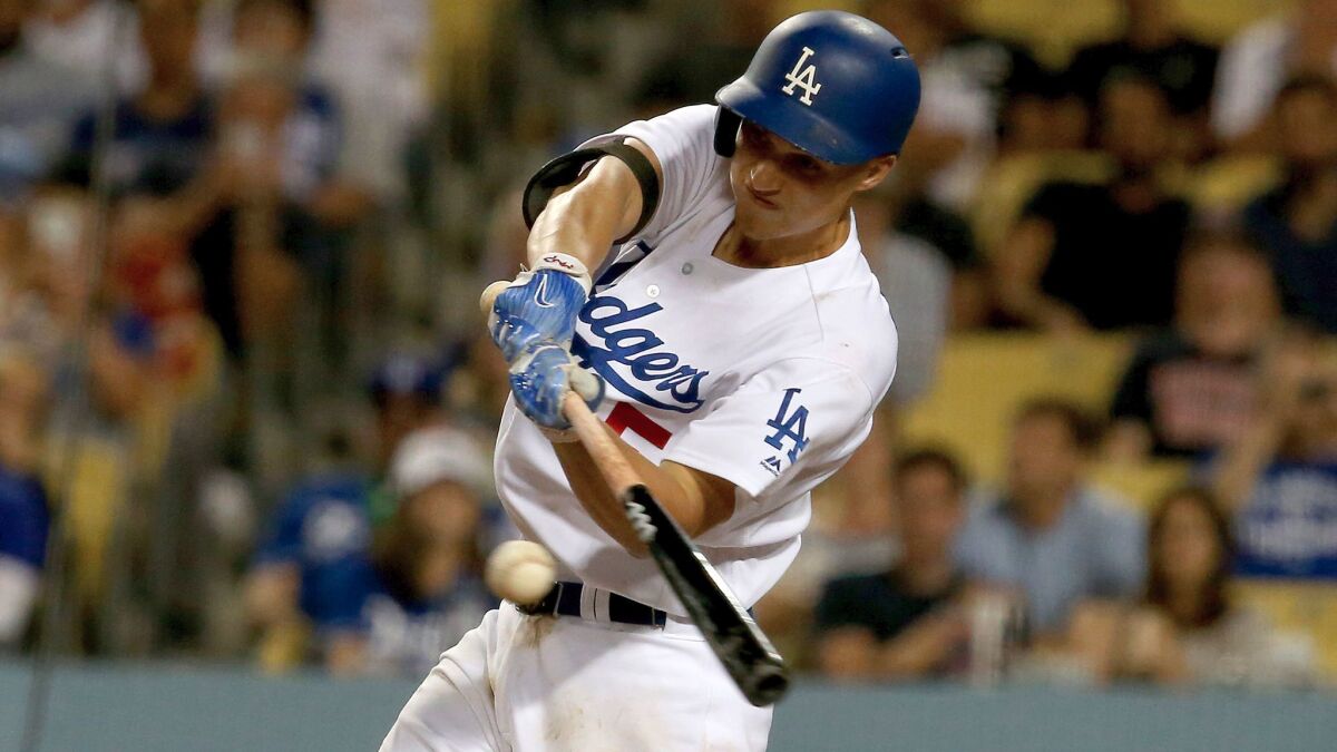 Dodgers shortstop Corey Seager connects for a double against the Arizona Diamondbacks on July 5 at Dodger Stadium.