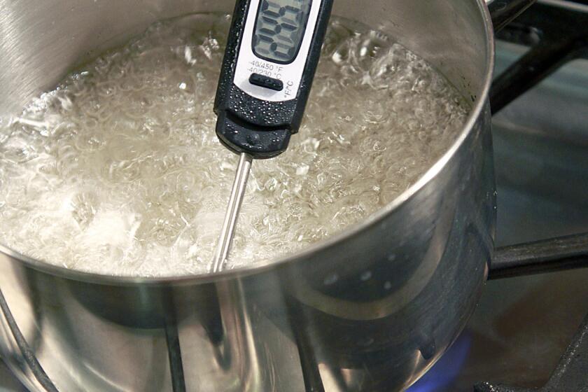 Cook sugar syrup until it reaches 240 degrees on a candy thermometer.