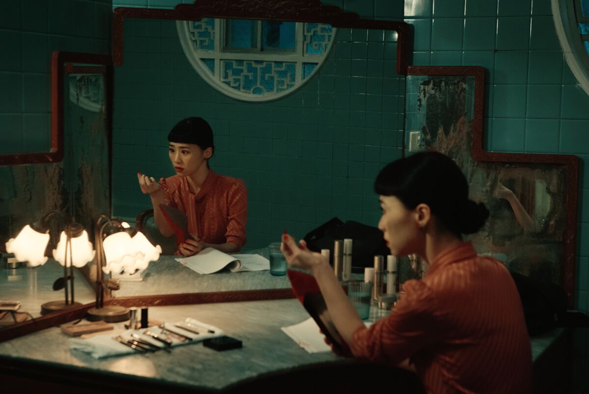 Wu Ke-Xi sits before a mirror in the movie "Nina Wu."