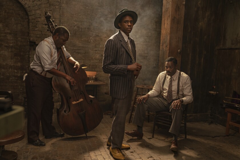 This image released by Netflix shows Michael Potts, from left, Chadwick Boseman and Colman Domingo in "Ma Rainey's Black Bottom." Boseman was nominated for an NAACP Image Award for outstanding actor in a motion picture for his performance in the film. Boseman was also nominated in the supporting actor in a motion picture for his role in the SPike Lee film "Da 5 Bloods." (David Lee/Netflix via AP)
