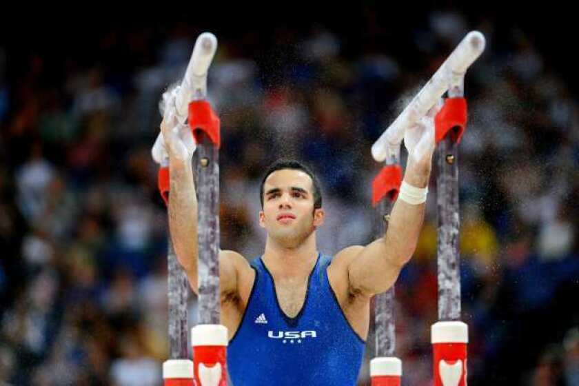 Danell Leyva prepares to compete on the parallel bars Wednesday.