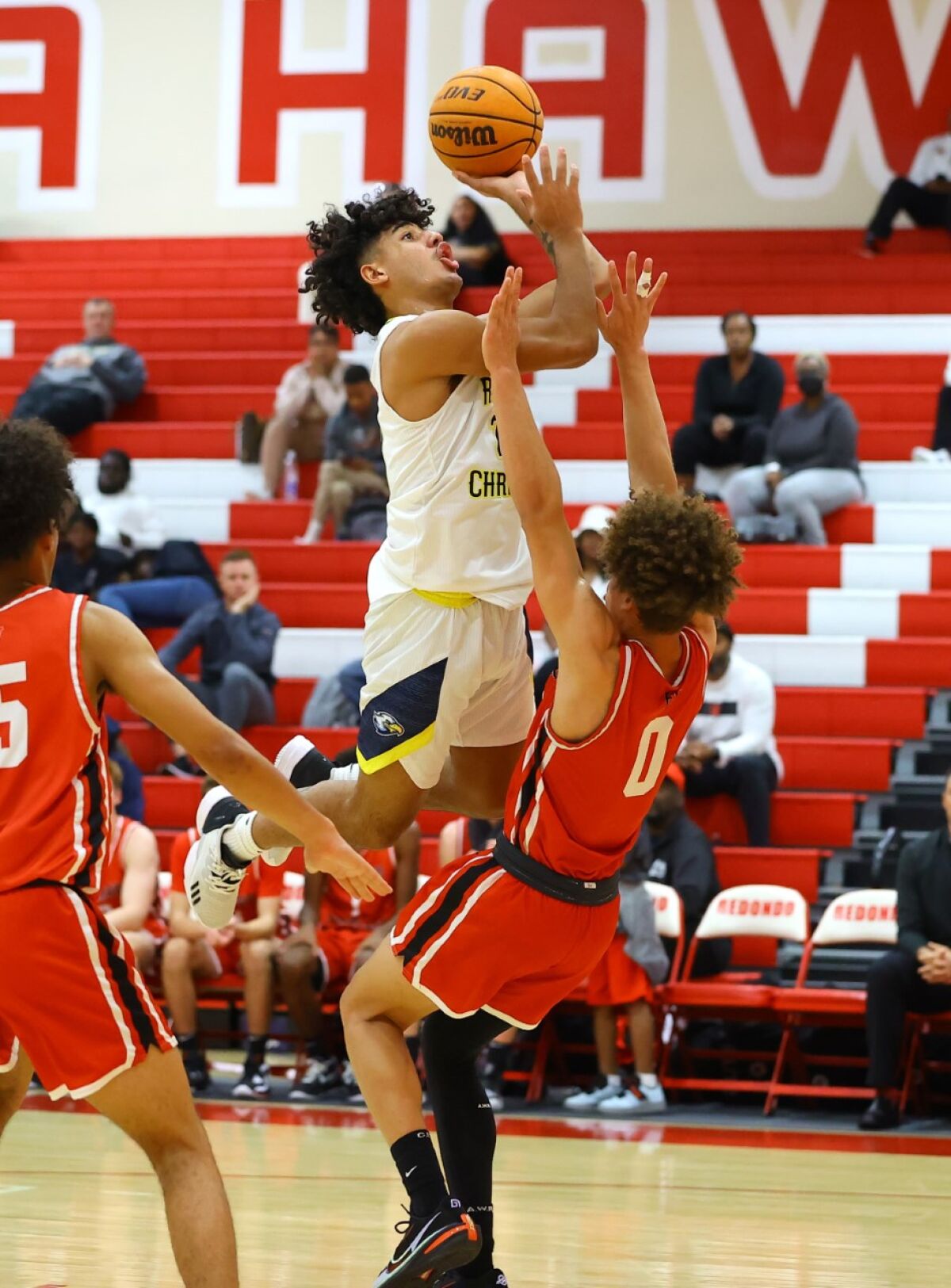 Trent Perry of Harvard-Westlake takes a charging foul.