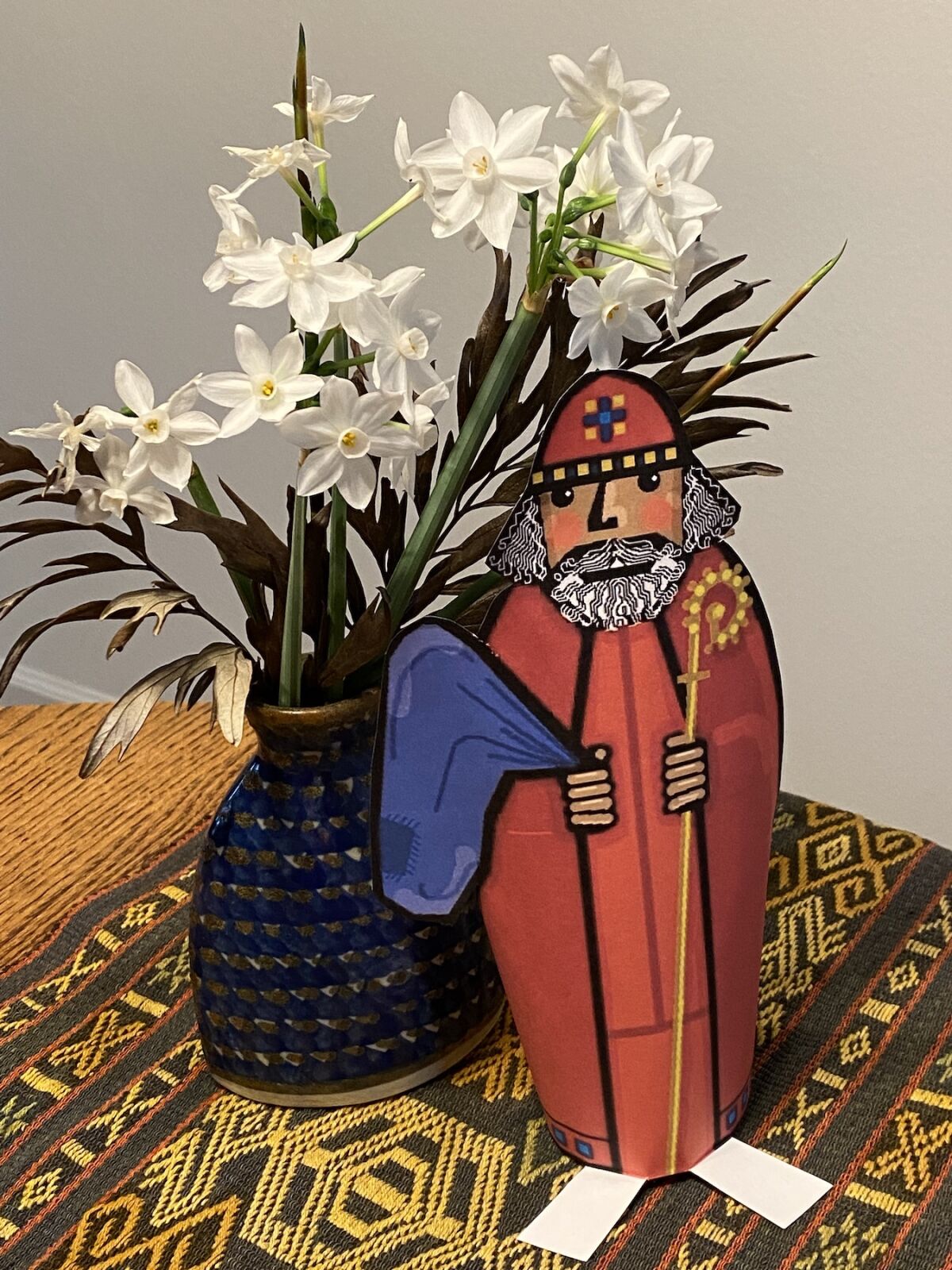 St. Nicholas, who was the inspiration for Santa Claus, with wild narcissus flowers found along a roadside.