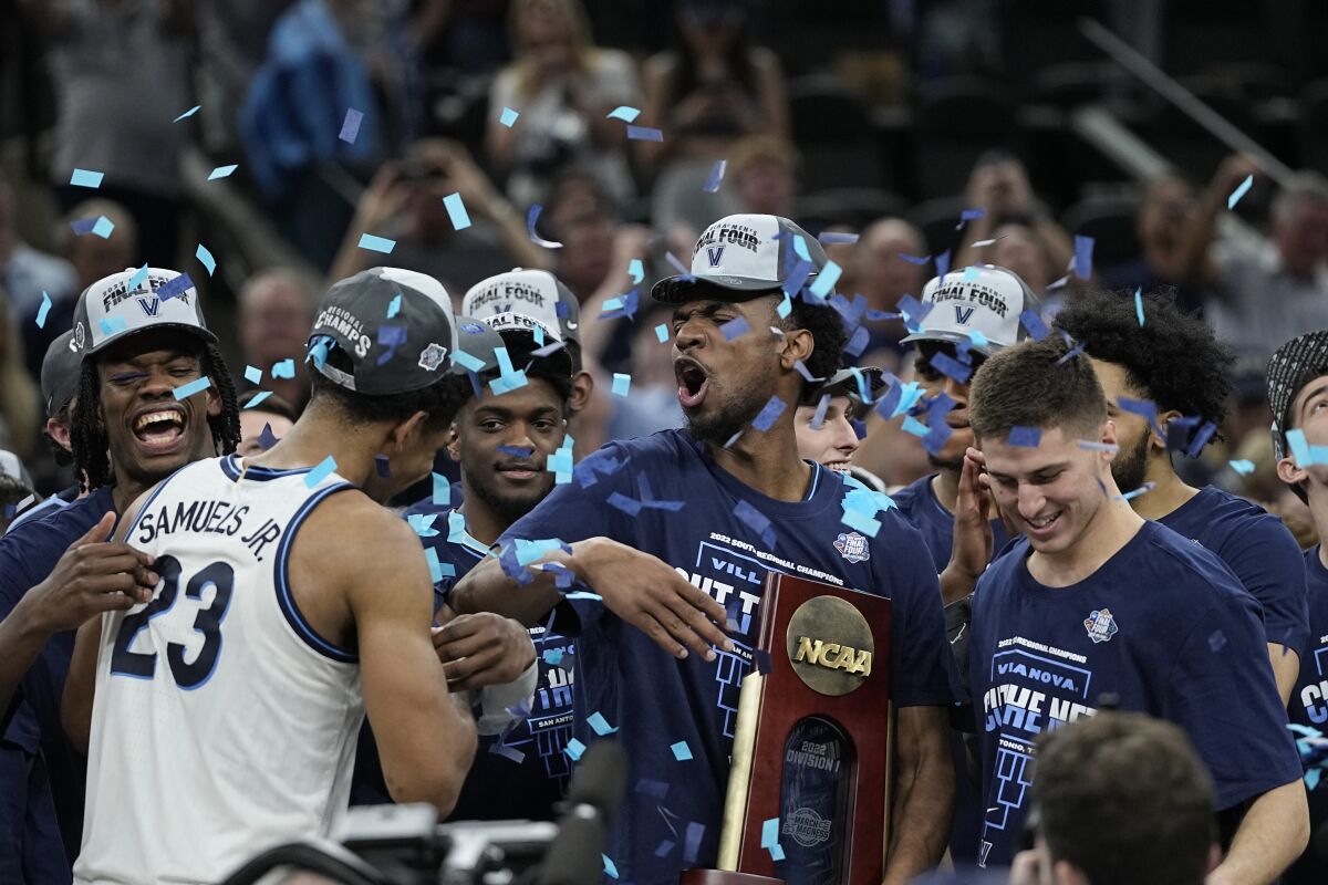 Villanova players celebrate their 50-44 win over Houston in the South Regional final March 26, 2022.