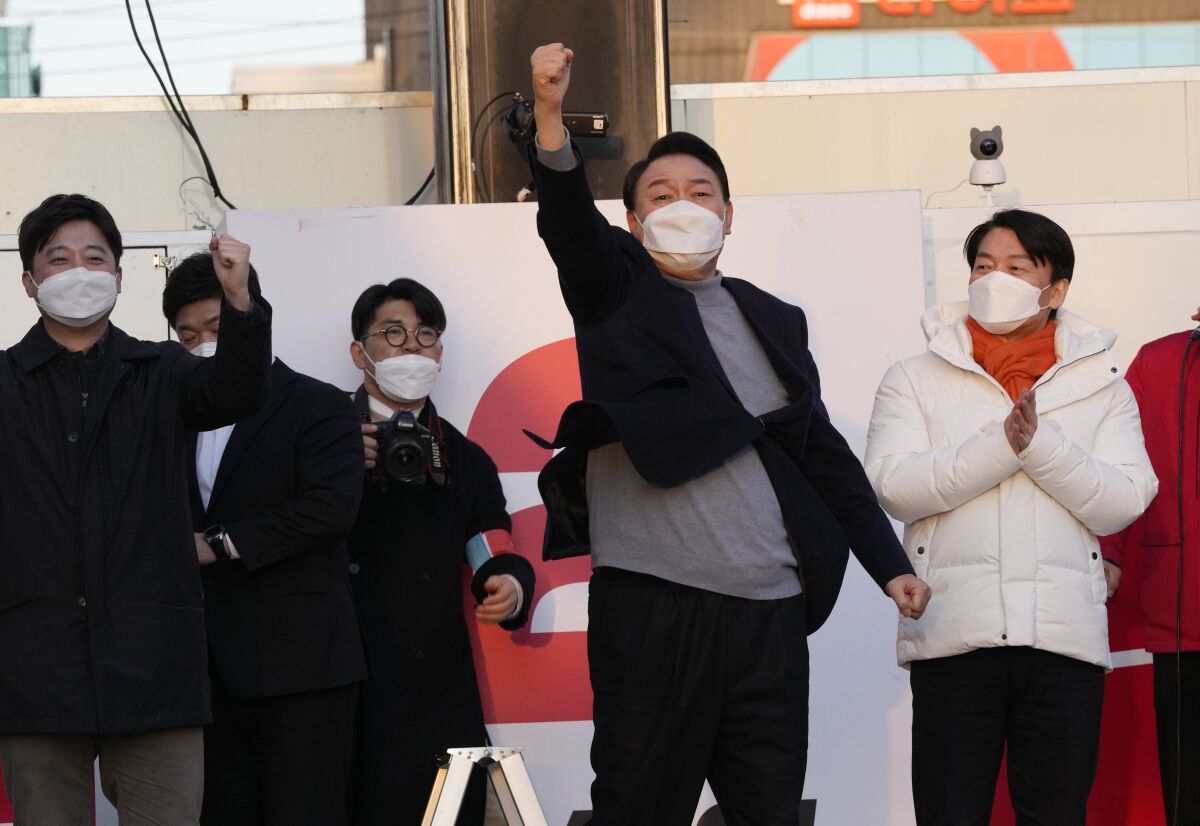 South Korean presidential candidate punching fist in the air