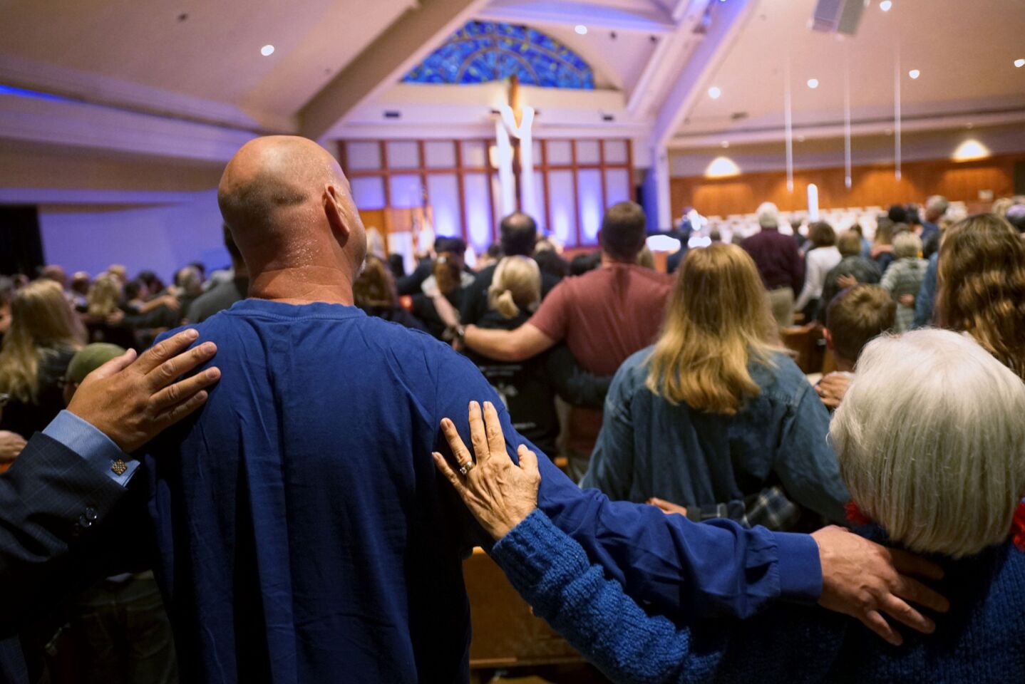 Mourners attend a vigil at Rancho Bernardo Community Presbyterian Church in Poway.