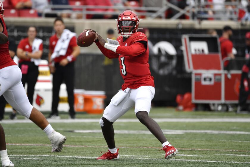 Louisville quarterback Malik Cunningham (3) drops back for a pass during the first half of an NCAA college football game against South Florida in Louisville, Ky., Saturday, Sept. 24, 2022. (AP Photo/Timothy D. Easley)