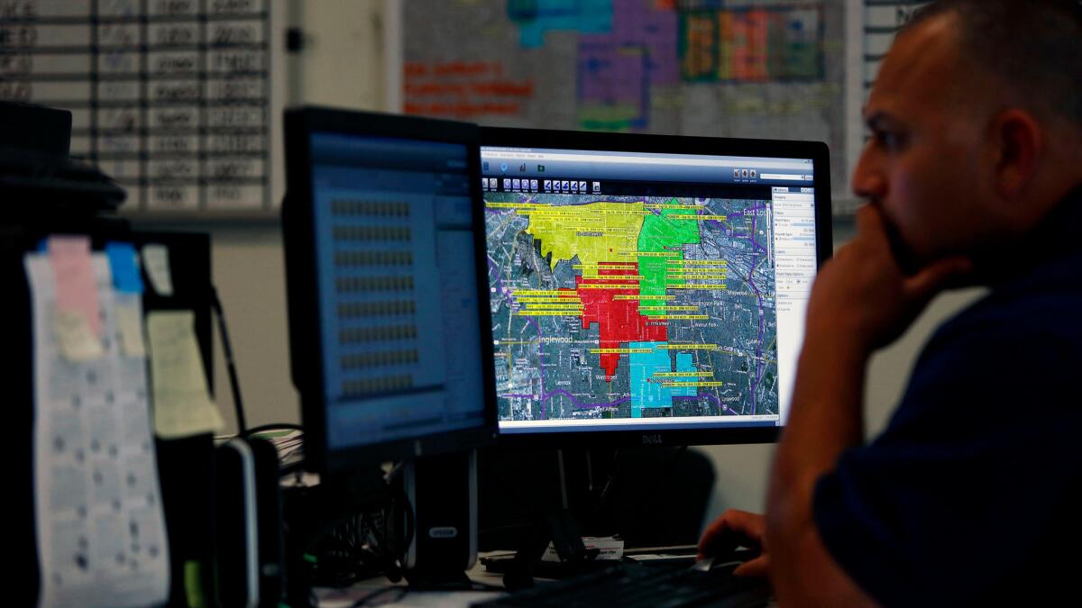 LAPD Officer David Gamero monitors crime trends and deploys police resources in real time from the Community Safety Operation Center.