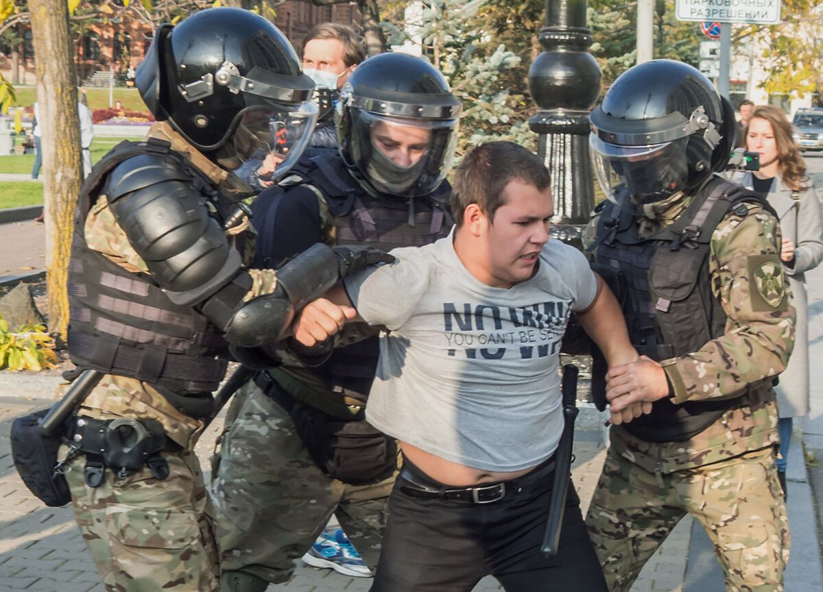 Police in riot gear detain a protester Saturday during a rally in Khabarovsk, Russia.