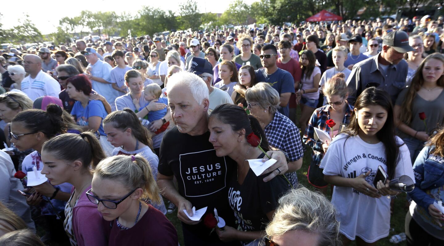 Mourners gather during a prayer vigil following a shooting at Santa Fe High School in Texas on Friday.