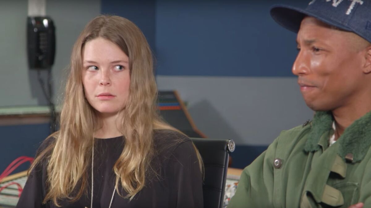 Screen capture of a YouTube video of Maggie Rogers and Pharrell Williams listening to her song "Alaska."