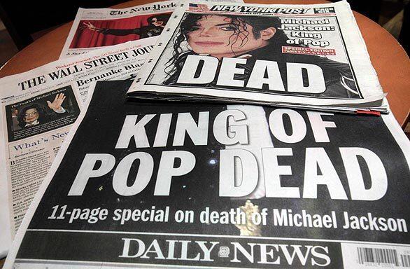 Newspaper front pages in New York banner the news of the death of Michael Jackson.