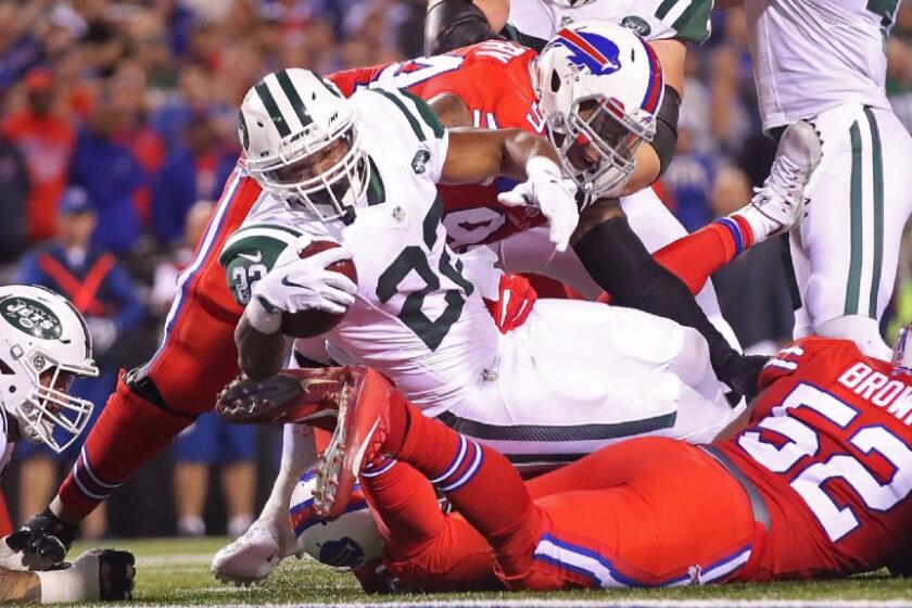 Jets running back Matt Forte plows into the end zone for one of his three rushing touchdowns against the Bills on Sept. 15.