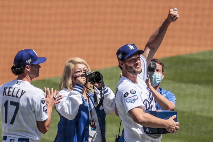 Los Angeles, CA, Friday, April 9, 2021 - Clayton Kershaw shows off his World Series ring during a ceremony on the field before the home opener at Dodger Stadium. (Robert Gauthier/Los Angeles Times)