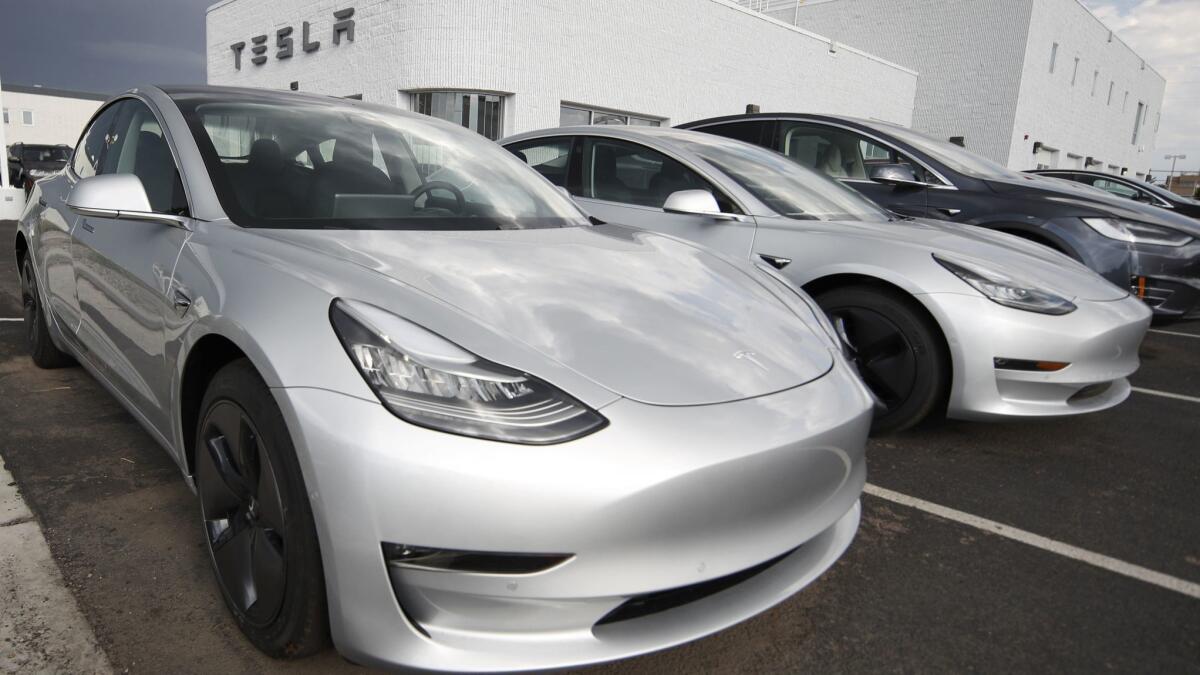 Model 3s on a retail lot in Colorado. Paid up customers want to know "where's mine?"