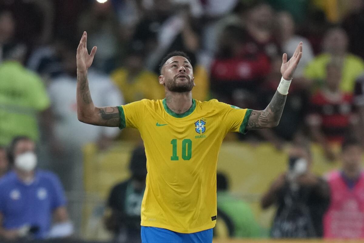 Brazil's Neymar celebrates after scoring his side's opening goal from the penalty spot during a qualifying soccer match for the FIFA World Cup Qatar 2022 against Chile at Maracana stadium in Rio de Janeiro, Brazil, Thursday, March 24, 2022.