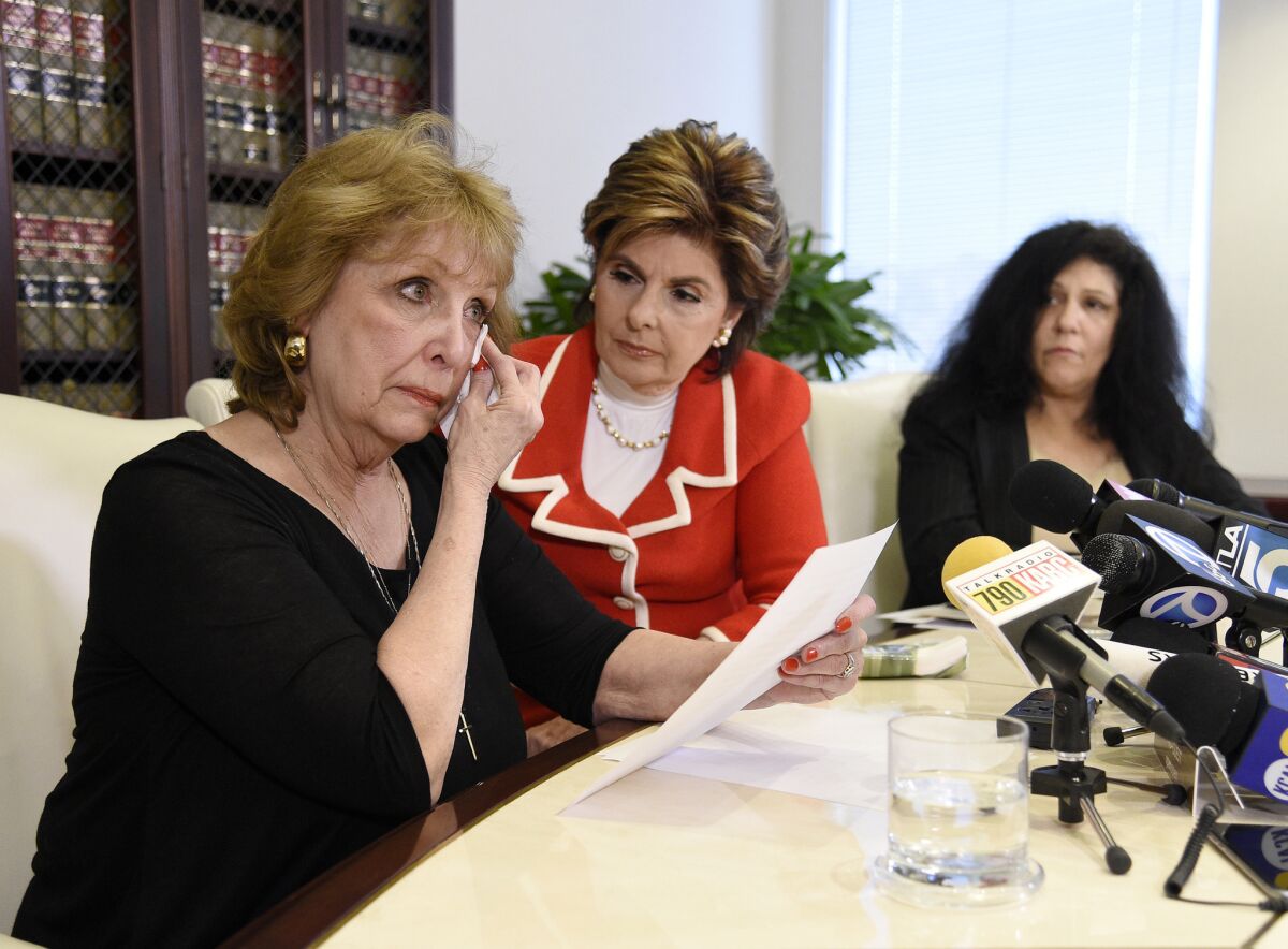 Sunni Welles, left, an alleged sexual assault victim of comedian Bill Cosby, speaks during a news conference with attorney Gloria Allred, center, in March 2015.