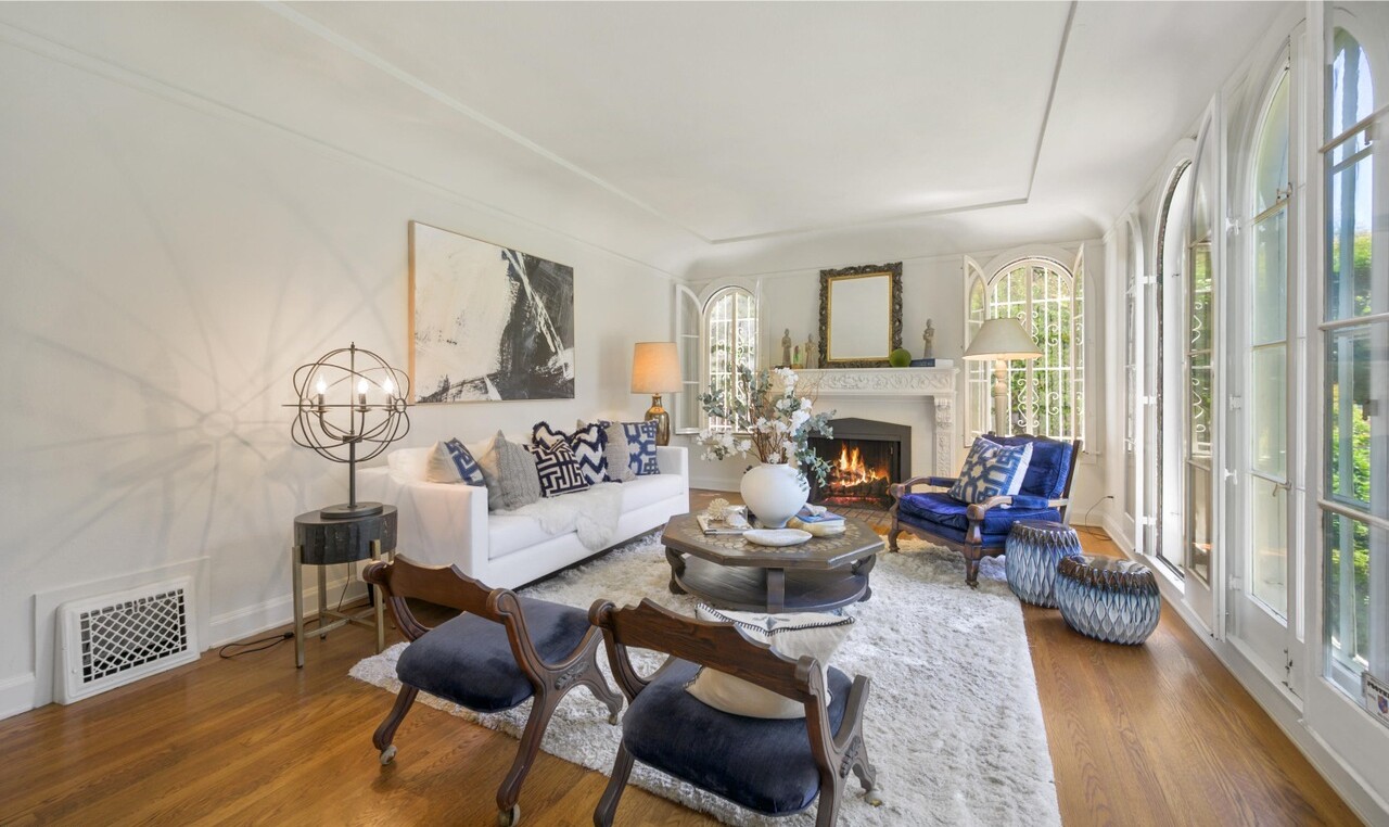 Built in 1925, the Spanish-style home stays in touch with its roots with dramatic arched windows and tray ceilings.