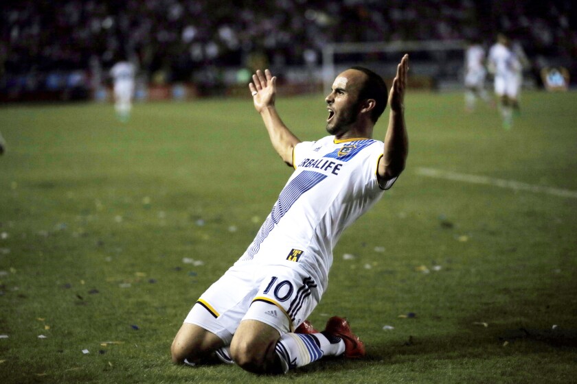 Los Angeles Galaxy's Landon Donovan celebrates scoring a goal against Real Salt Lake during the second half of an MLS soccer Western Conference playoff series game, in Carson, Calif., Sunday, Nov. 9, 2014.