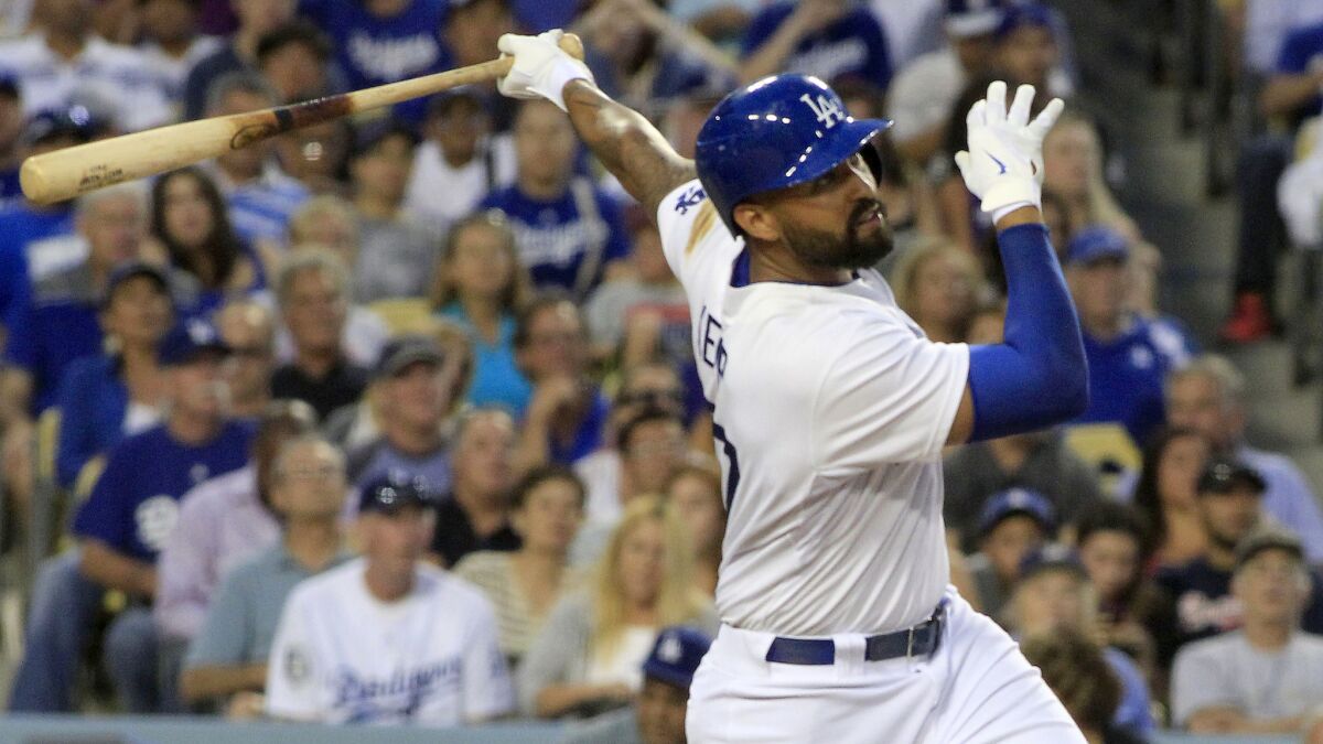 Dodgers outfielder Matt Kemp hits a two-run home run against the Atlanta Braves in July at Dodger Stadium. Kemp was traded to the San Diego Padres on Thursday.