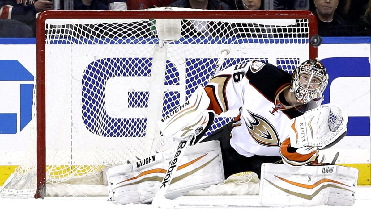 Ducks goalie John Gibson stops a shot by the Rangers during the first period of their game Sunday in New York.
