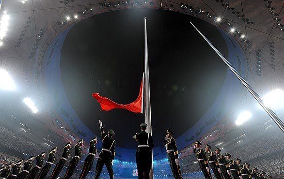 People's Liberation Army soldiers raise the Chinese flag at the opening ceremony of the Beijing 2008 Paralympic Games.