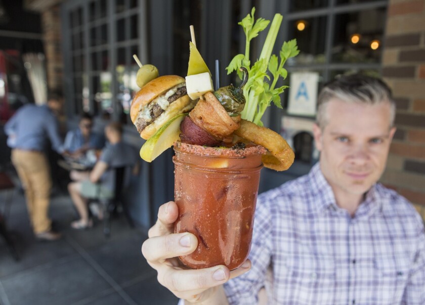 Larry Caldwell shows a glass of the Bloody Royale at Franklin & Company. The first Bloody Mary Battle is taking place June 28 in Santa Monica.