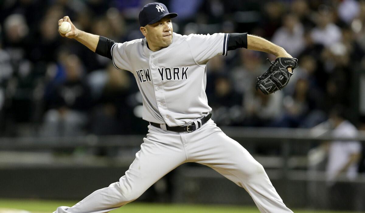 Yankees relief pitcher Alfredo Aceves works against the White Sox during a game earlier this season in Chicago.