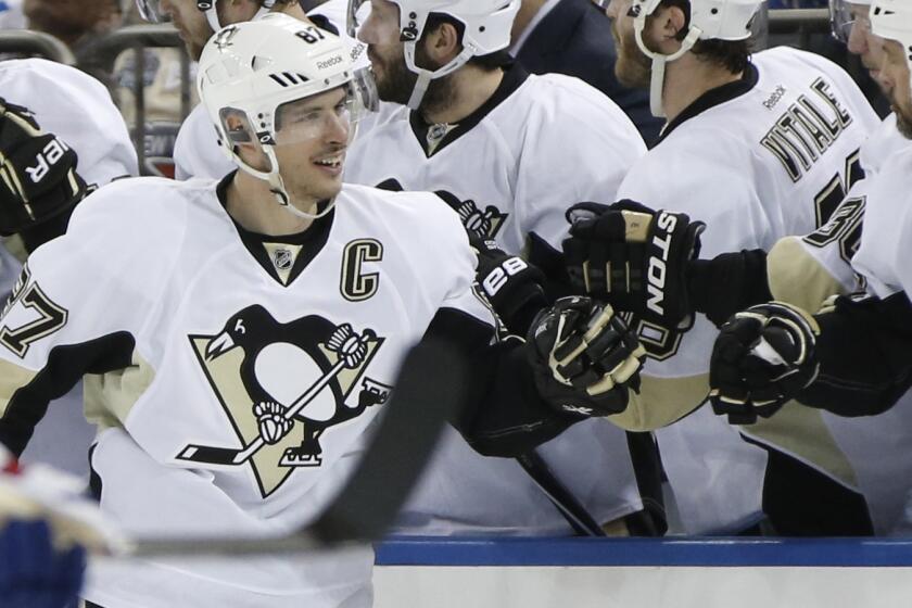 Pittsburgh Penguins captain Sidney Crosby celebrates with his teammates after scoring during the team's 2-0 victory over the New York Rangers in Game 3 of the Eastern Conference semifinals on Monday.