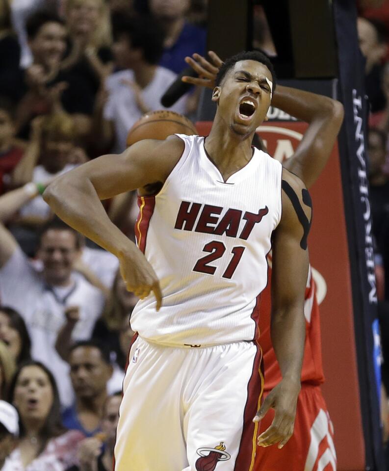 Miami Heat center Hassan Whiteside (21) celebrates after scoring against the Houston Rockets in the first half of an NBA basketball game, Sunday, Nov. 1, 2015, in Miami.