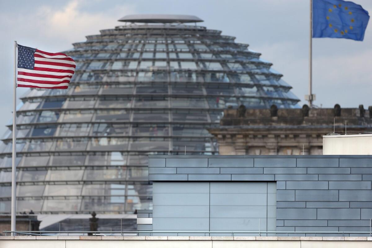 A U.S. flag flies from the roof of the U.S. Embassy in Berlin.