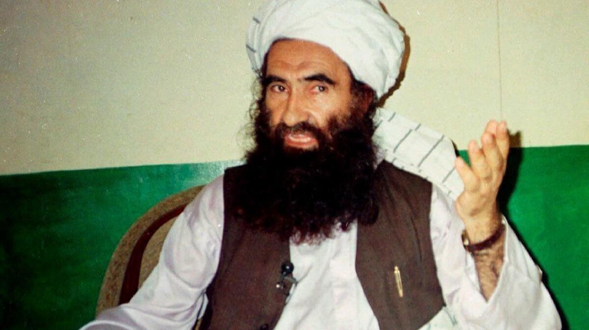 In this 1998 file photo, Jalaluddin Haqqani, founder of the Haqqani network militant group, speaks during an interview in Miram Shah, Pakistan.