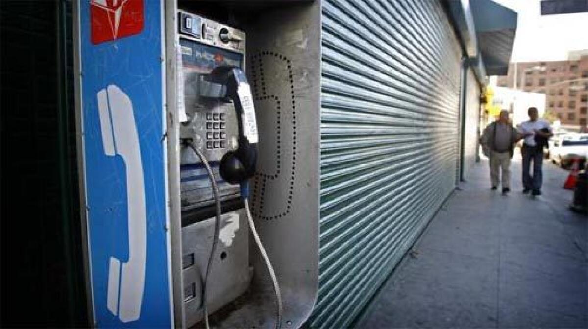 AT&T says it plans to end its dwindling pay phone business by the end of 2008, as more consumers use mobile phones.