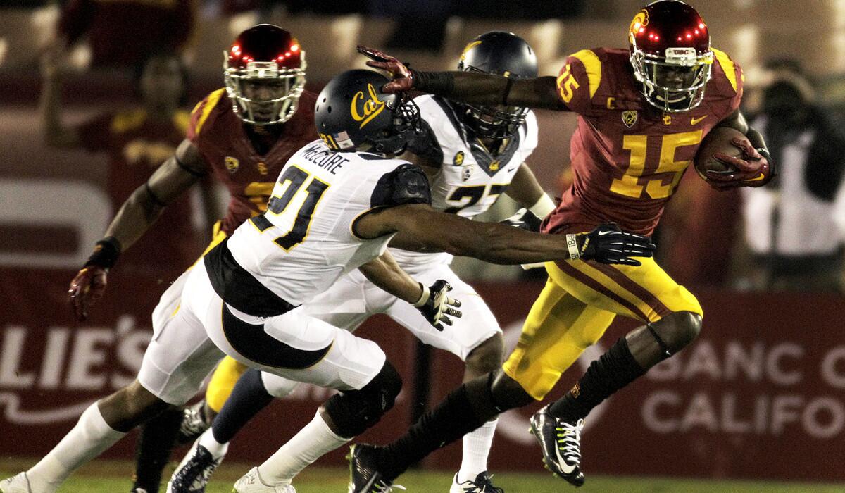 California safety Stefan McClure tries to tackle USC wide receiver Nelson Agholor after he made a reception in the first half.