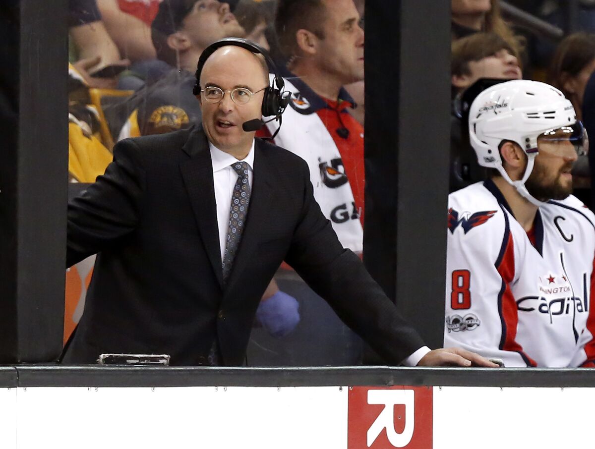 FILE - Pierre McGuire broadcasts during the third period of an NHL hockey game between the Boston Bruins and the Washington Capitals in Boston, in this Saturday, April 8, 2017, file photo. Longtime television analyst Pierre McGuire is returning to an NHL front office as senior vice president of player development for the Ottawa Senators. The club announced McGuire's appointment Monday morning, July 12, 2021. (AP Photo/Winslow Townson, File)