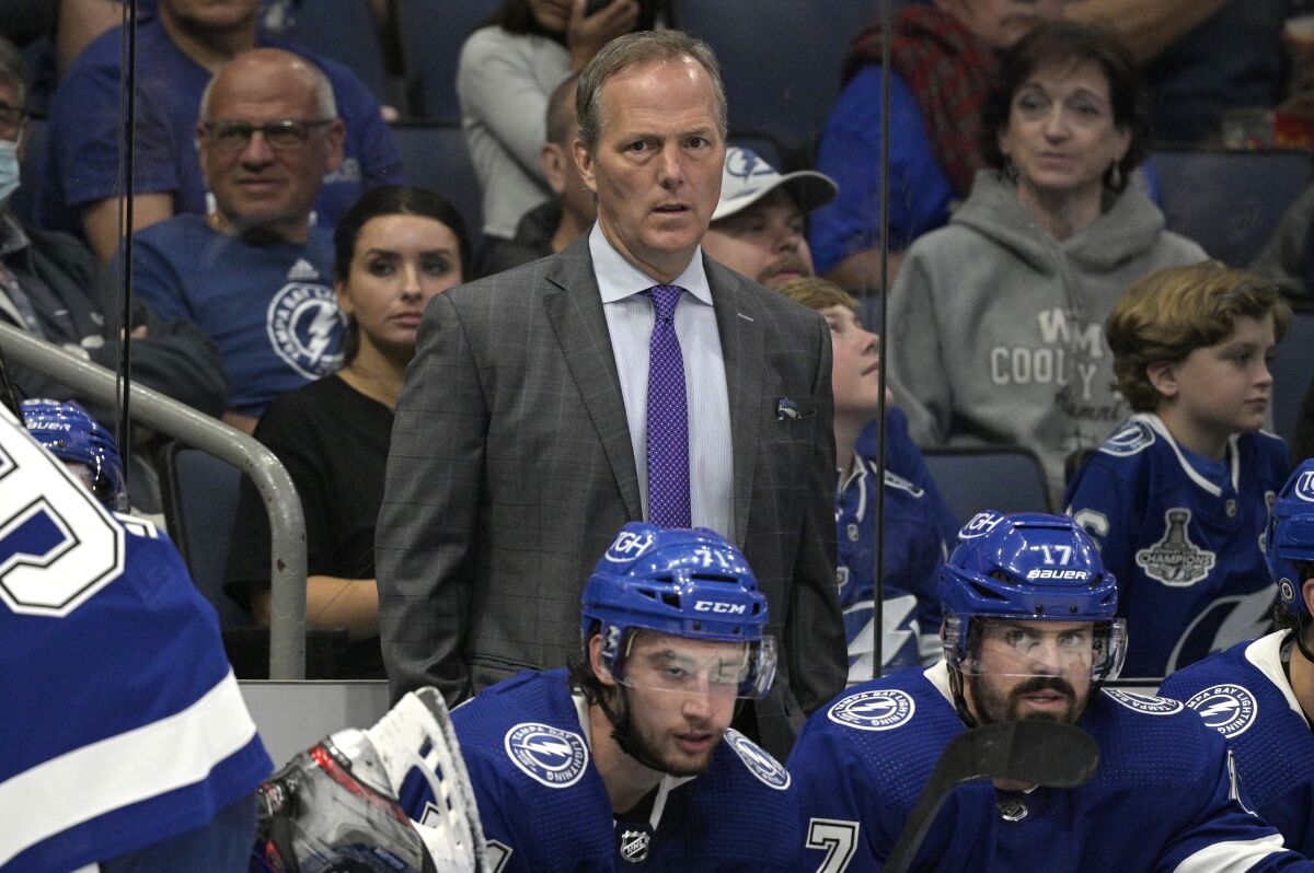 Tampa Bay Lightning coach Jon Cooper watches during the third period of the team's preseason NHL hockey game against the Florida Panthers, Thursday, Oct. 7, 2021, in Tampa, Fla. (AP Photo/Phelan M. Ebenhack)