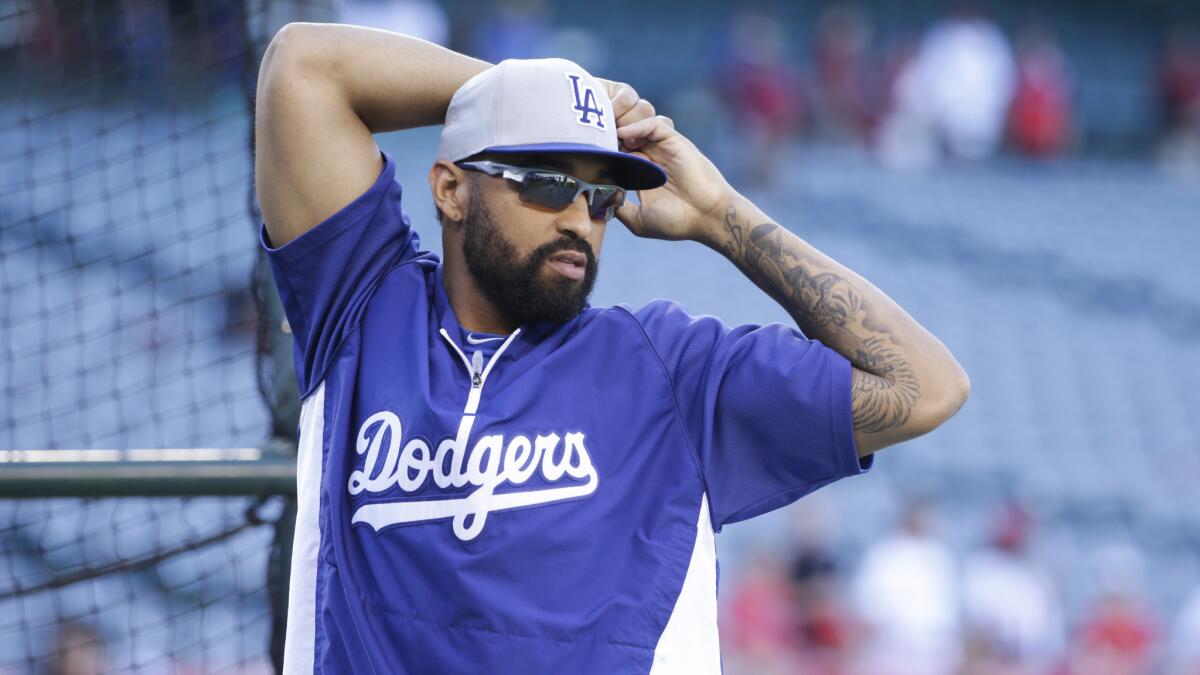 Dodgers outfielder Matt Kemp stretches before Wednesday's game against the Angels.
