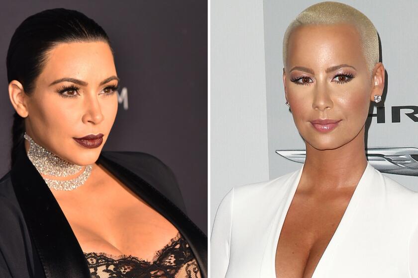 Kim Kardashian, left, and Amber Rose appear to squash the beef between feuding rappers Kanye West and Wiz Khalifa.