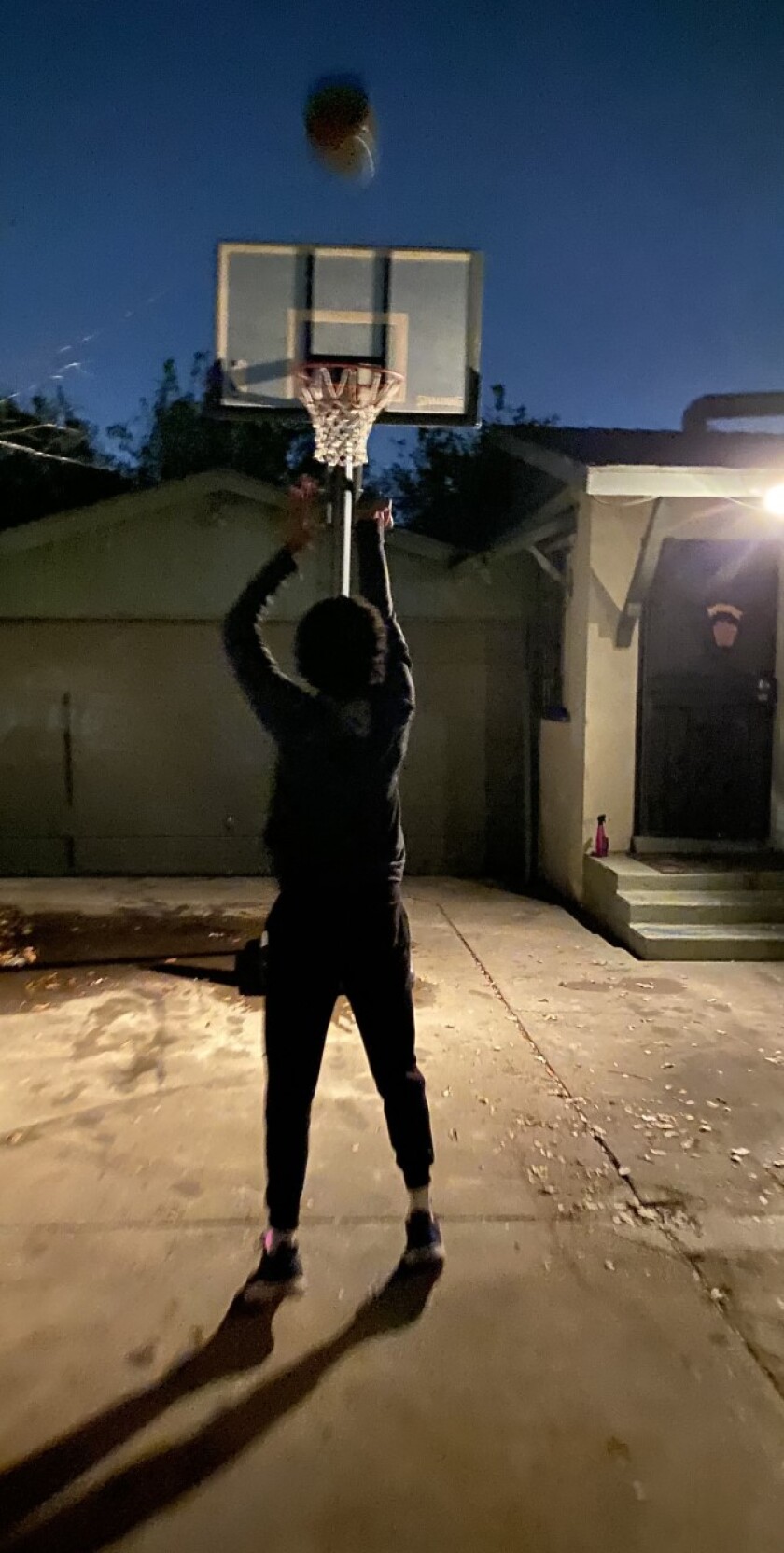 Ontario Colony point guard Brenton Knapper practicing on his home basket during the pandemic.