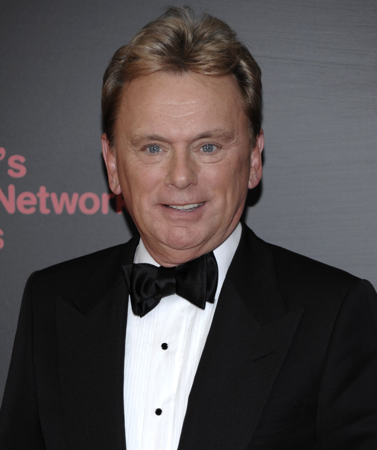 Pat Sajak in a black tuxedo arrives at an event.