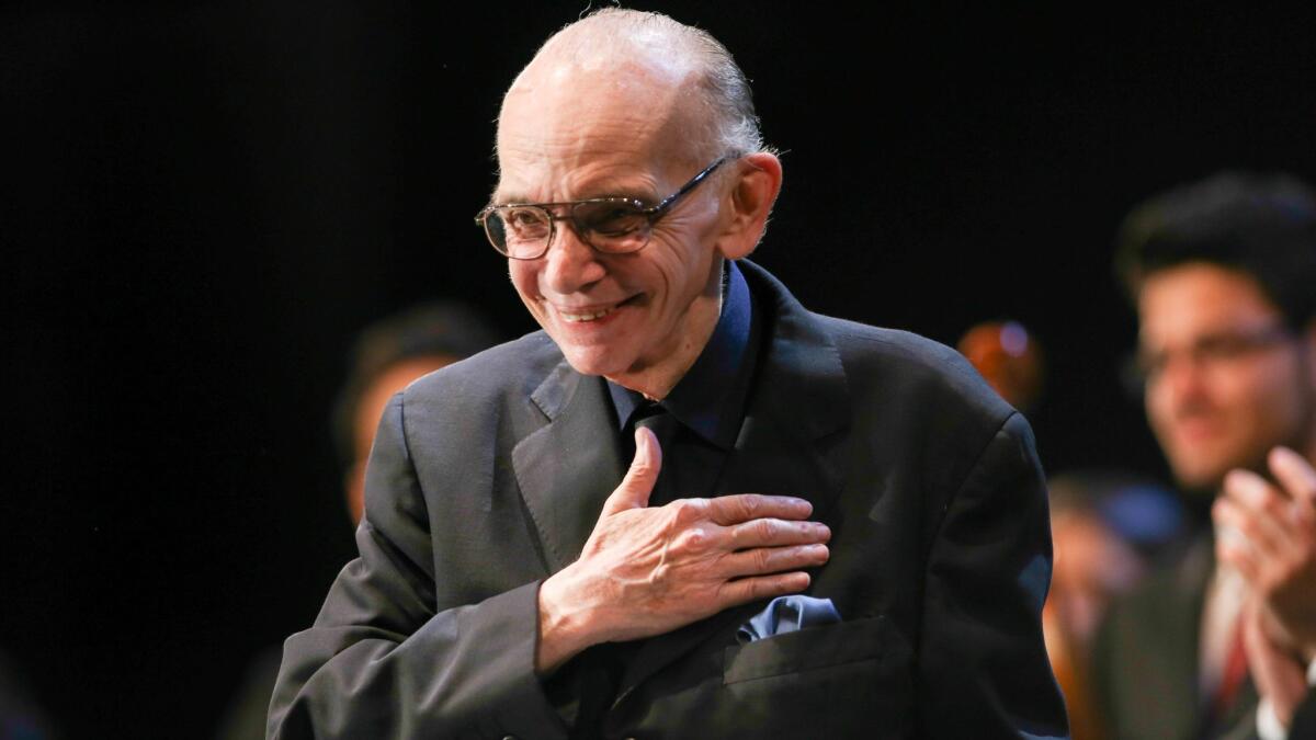 Jose Abreu, founder of El Sistema, receives applause as he speaks during the opening of the 2013 Salzburg Festival in Austria. Abreu died on March 24 at age 78.